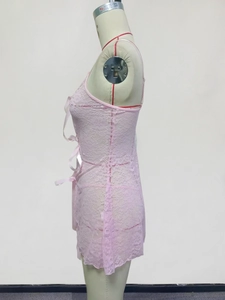 Detailed side view of pink lace babydoll with mesh texture and satin bow accents