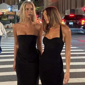 Detail of two black bodycon mesh dresses in tube top and halter neck styles