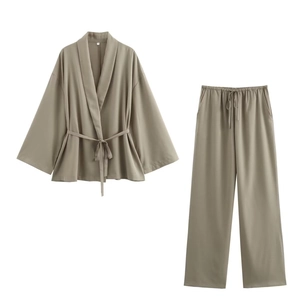 Two-piece olive green kimono wrap top and wide-leg trousers set in premium fabric
