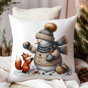 Détail de la housse de coussin de Noël avec motif doré de bonhomme de neige et renard