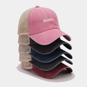 Detailed stack of vintage washed mesh baseball caps with Mommy embroidery in various colors