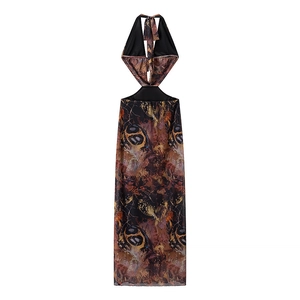 Detail of a brown abstract print halter neck dress featuring an open back and tie-up design