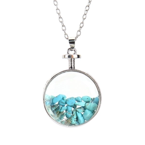 Close-up of a silver O-chain necklace with a round glass pendant filled with blue stones