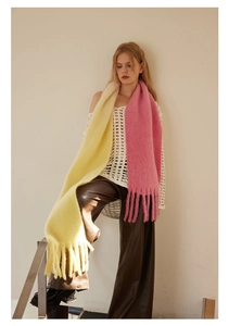 Detail of wool blend gradient scarf in pink and yellow with soft fringed ends