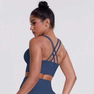 Detail shot of navy blue sports bra with elegant multi-strap criss-cross back design