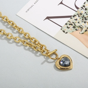 Detail of 18k gold plated chain necklace with heart pendant and T-bar toggle clasp