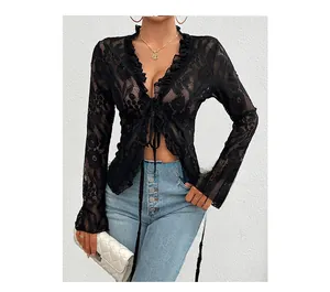 Detailed close-up of a black lace long sleeve cardigan with ruffle trim and tie-front