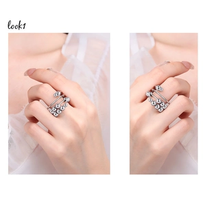 Detailed view of silver layered anxiety ring with rotating beads for stress relief