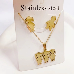 Gold stainless steel jewelry set featuring cute boy and girl character charms on white card