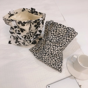Minimalist cotton tote bags with floral and leaf patterns in black and white styles