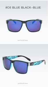 Detail view of sport sunglasses with black frames and blue lenses for outdoor cycling