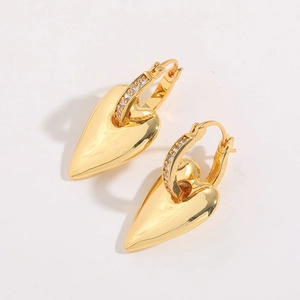 Close-up of heart dangle earrings with 18K gold plating and white zircon inlay