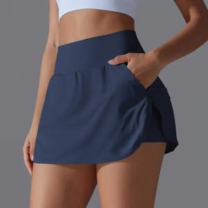 Detail view of high waisted navy skort showing wide waistband and side storage pocket
