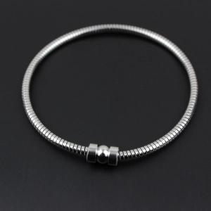 Detailed top view of a polished silver snake chain bracelet with a cylindrical magnetic clasp
