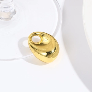 Close-up of golden irregular teardrop hollow pendant with a polished minimalist surface