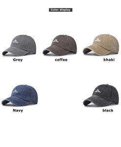 Close-up of vintage washed cotton baseball caps with mountain embroidery in five colors