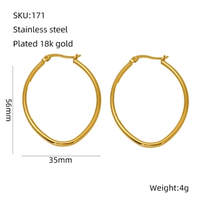 Detail view of 18k gold plated oval earrings with 56mm x 35mm dimensions and 4g weight