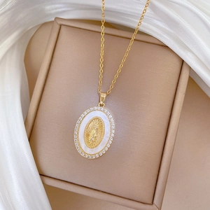 Gold titanium steel necklace with oval Madonna shell pendant and sparkling rhinestones