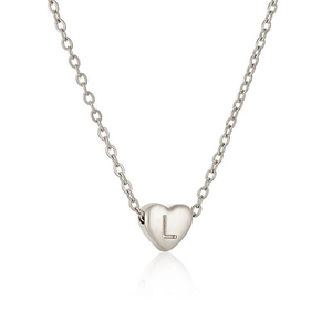 Macro shot of silver heart pendant with engraved letter L on delicate O-chain necklace