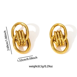 Macro view of multi-layered 18K gold-plated titanium earrings with dimensions 2.69x1.52cm