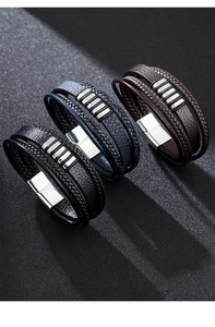 Detail view of multi-layer braided leather bracelets in black, blue and brown with magnetic clasp