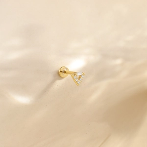 Detail view of a 925 sterling silver gold-plated triangle ear stud with zircon tassels