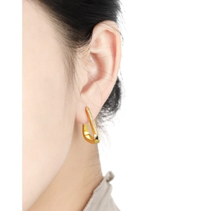 Minimalist S925 sterling silver triangle stud earrings with zircon on a female model