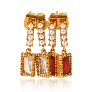 Vintage gold earrings with vertical white pearls and large rectangular crystal drops