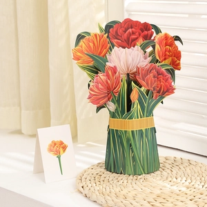 Detail of 3D pop-up paper flower bouquet with red tulips in a green decorative vase