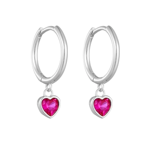Close-up of S925 silver huggie earrings with pink heart-shaped zircon stones