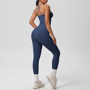 Detail of cross-back straps and high-waist fit on dark blue seamless yoga set