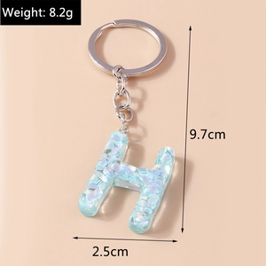 Detail view of light blue sequined letter H keychain with 9.7cm height and 8.2g weight