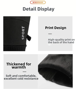 Detail of windproof fabric and thick fleece lining on black winter sport gloves