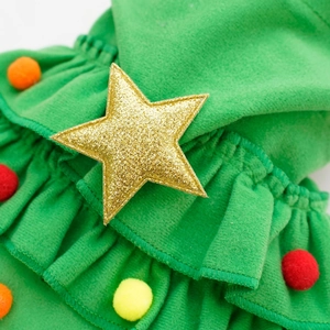 Detail of Christmas tree pet cloak with golden stars and colorful pompom decorations