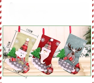 Macro view of Christmas stocking decorations with reindeer and santa claus applique