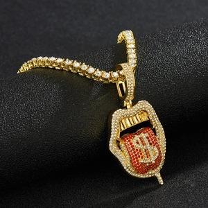 Macro shot of hip-hop pendant featuring a rhinestone-encrusted lip and dollar sign tongue