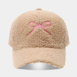 Beige Sherpa fleece baseball cap with pink embroidered bow and curved brim for winter