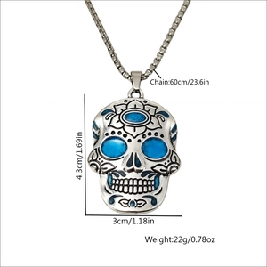 Luminous sugar skull necklace with blue details and dimensions in silver finish