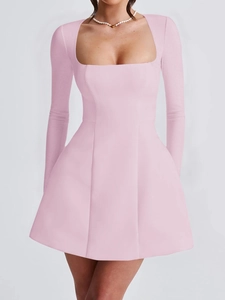 Detail of pink long sleeve mini dress featuring an elegant square neck and A-line waist