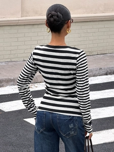Women's slim fit long sleeve striped T-shirt featuring a classic black and white pattern