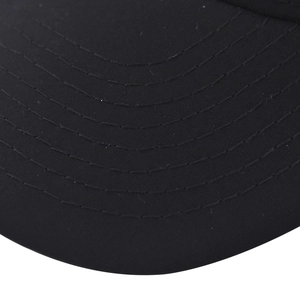Close-up of a solid black baseball cap brim with six rows of reinforced parallel stitching