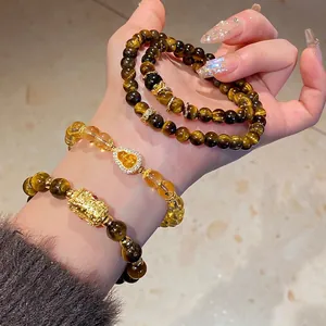 Tiger eye and citrine stacked bracelets with zircon flower and golden ruyi charms