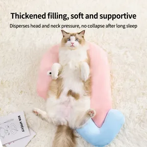 Pink and blue ergonomic pet neck pillow for cats and dogs on a plush white rug