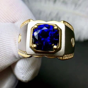 Two-tone men's ring with square blue sapphire and screw patterns on gold and silver band