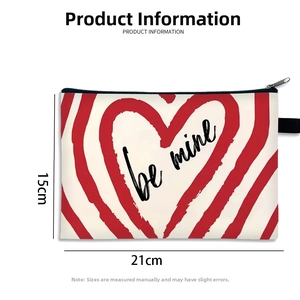 Detailed size view of Be Mine heart print canvas makeup bag measuring 21cm by 15cm