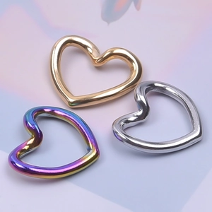 Three stainless steel heart-shaped rings in gold, silver, and rainbow plating