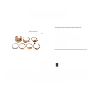 Detailed size guide for 7-piece gold metal ring set with resin and rhinestone accents
