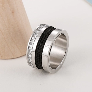 Detail of Roman numeral titanium steel ring with black wire wrap and square crystals