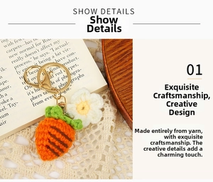 Close-up of handmade crochet carrot and flower keychain with golden metal clasp