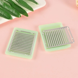 Miniature dollhouse kitchen grill set with green rectangular trays and silver metal racks